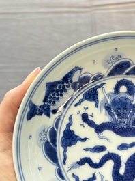 A Chinese blue and white 'dragon and carps' plate, Yongzheng mark and of the period