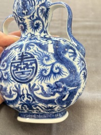 A rare and fine Chinese blue and white double gourd 'dragon' vase with ruyi handles, Qianlong mark and of the period