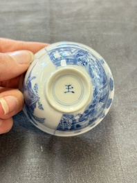 A Chinese blue and white 'Rotterdam Riot' cup and saucer, jade mark, Kangxi
