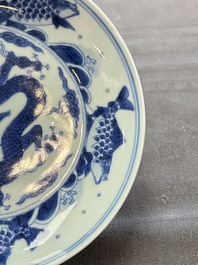 A Chinese blue and white 'dragon and carps' plate, Yongzheng mark and of the period