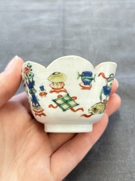 A pair of Chinese famille verte cups and saucers with antiquities, Kangxi