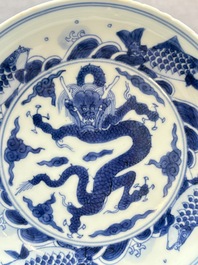 A Chinese blue and white 'dragon and carps' plate, Yongzheng mark and of the period