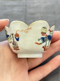 A pair of Chinese famille verte cups and saucers with antiquities, Kangxi
