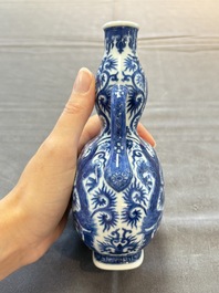 A rare and fine Chinese blue and white double gourd 'dragon' vase with ruyi handles, Qianlong mark and of the period