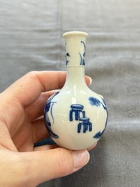 A fine Chinese blue and white miniature bottle vase with two ladies in a garden, jade 玉 mark, Kangxi