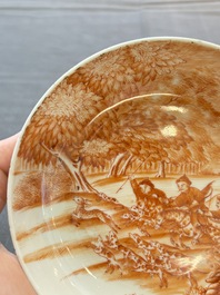 A Chinese iron-red-decorated 'Deer Hunting' cup and saucer, Qianlong