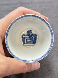A Chinese blue and white 'Rotterdam Riot' cup and saucer, jade mark, Kangxi