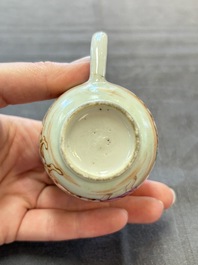 A varied collection of three Chinese famille rose 'mythological subject' cups and two saucers, Qianlong