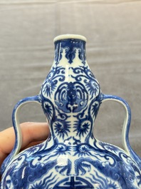 A rare and fine Chinese blue and white double gourd 'dragon' vase with ruyi handles, Qianlong mark and of the period