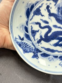A Chinese blue and white 'dragon and carps' plate, Yongzheng mark and of the period