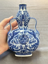 A rare and fine Chinese blue and white double gourd 'dragon' vase with ruyi handles, Qianlong mark and of the period