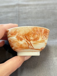 A Chinese iron-red-decorated 'Deer Hunting' cup and saucer, Qianlong