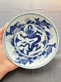 A Chinese blue and white 'dragon and carps' plate, Yongzheng mark and of the period