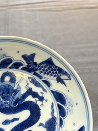 A Chinese blue and white 'dragon and carps' plate, Yongzheng mark and of the period