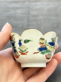 A pair of Chinese famille verte cups and saucers with antiquities, Kangxi