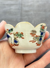 A pair of Chinese famille verte cups and saucers with antiquities, Kangxi