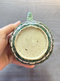A Chinese verte biscuit teapot and cover with floral design, Kangxi