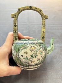 A Chinese verte biscuit teapot and cover with floral design, Kangxi