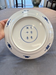 Two Chinese blue and white plates with figural design, Kangxi marks and of the period