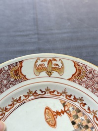 A rare Chinese polychrome 'Commedia dell'arte' 'South Sea Bubble' plate, Yongzheng, ca. 1720-1725