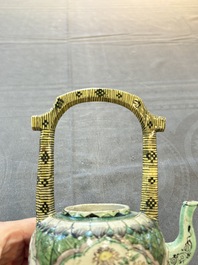 A Chinese verte biscuit teapot and cover with floral design, Kangxi