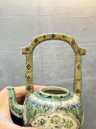 A Chinese verte biscuit teapot and cover with floral design, Kangxi