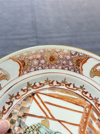 A rare Chinese polychrome 'Commedia dell'arte' 'South Sea Bubble' plate, Yongzheng, ca. 1720-1725