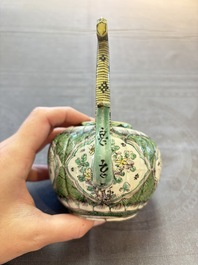 A Chinese verte biscuit teapot and cover with floral design, Kangxi