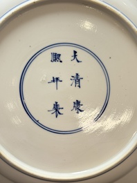 Two Chinese blue and white plates with figural design, Kangxi marks and of the period