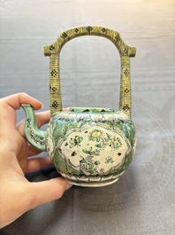 A Chinese verte biscuit teapot and cover with floral design, Kangxi