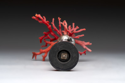 A red coral mounted silver figure, possibly Germany, 19th C.