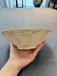 A Samanid pottery 'Kufic' inscribed bowl and a white-spotted brown-ground bowl, Iran, 10th C.