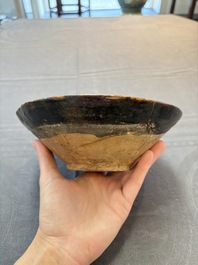 A Samanid pottery 'Kufic' inscribed bowl and a white-spotted brown-ground bowl, Iran, 10th C.