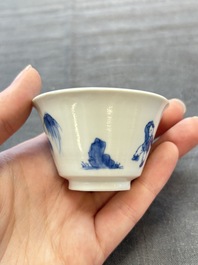 A pair of Chinese blue and white 'Elegant Beauty and Boy' cups and saucers, Chenghua mark, Kangxi