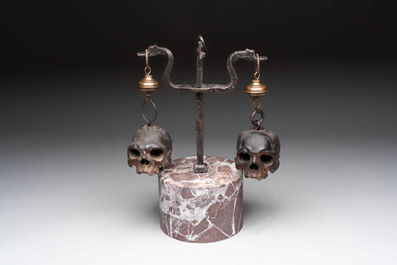 An Italian 'vanitas' or 'memento mori' composition with skulls and forged iron mount, 18/19th C.