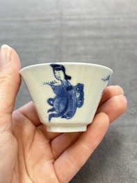A pair of Chinese blue and white 'elegant beauty and boy' cups and saucers, Chenghua mark, Kangxi