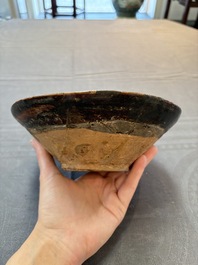 A Samanid pottery 'Kufic' inscribed bowl and a white-spotted brown-ground bowl, Iran, 10th C.