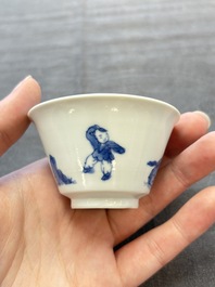 A pair of Chinese blue and white 'Elegant Beauty and Boy' cups and saucers, Chenghua mark, Kangxi