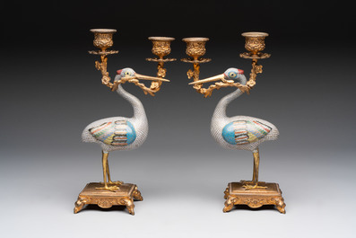 A pair of Chinese cloisonn&eacute; cranes, later mounted as candelabras, 19th C.