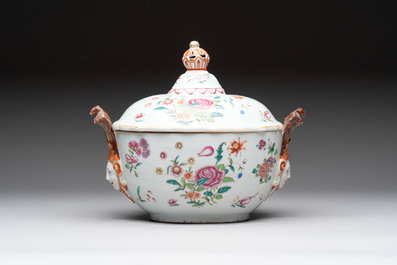 A Chinese famille rose 'mascarons' tureen and cover on stand with floral design, Qianlong