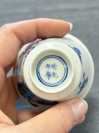 A pair of Chinese blue and white 'Elegant Beauty and Boy' cups and saucers, Chenghua mark, Kangxi