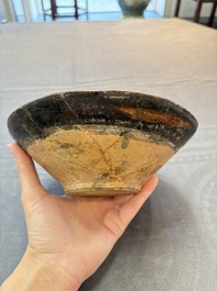 A Samanid pottery 'Kufic' inscribed bowl and a white-spotted brown-ground bowl, Iran, 10th C.
