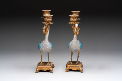 A pair of Chinese cloisonn&eacute; cranes, later mounted as candelabras, 19th C.