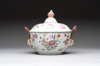 A Chinese famille rose 'mascarons' tureen and cover on stand with floral design, Qianlong