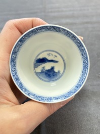A pair of Chinese blue and white 'Elegant Beauty and Boy' cups and saucers, Chenghua mark, Kangxi