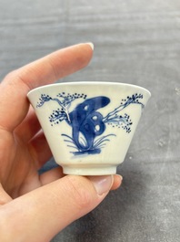 A pair of Chinese blue and white 'elegant beauty and boy' cups and saucers, Chenghua mark, Kangxi