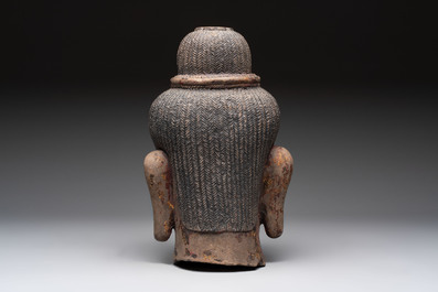 A Cambodian stone head of Shiva with braided hair and traces of gilt lacquer, Khmer Baphuon-style, 20th C.