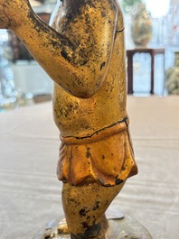 A rare and large Chinese gilt-lacquered bronze Buddha, Ming