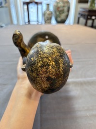 A rare and large Chinese gilt-lacquered bronze Buddha, Ming