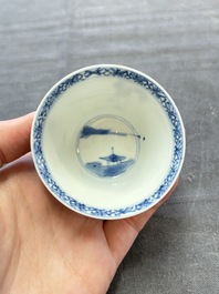 A pair of Chinese blue and white 'elegant beauty and boy' cups and saucers, Chenghua mark, Kangxi